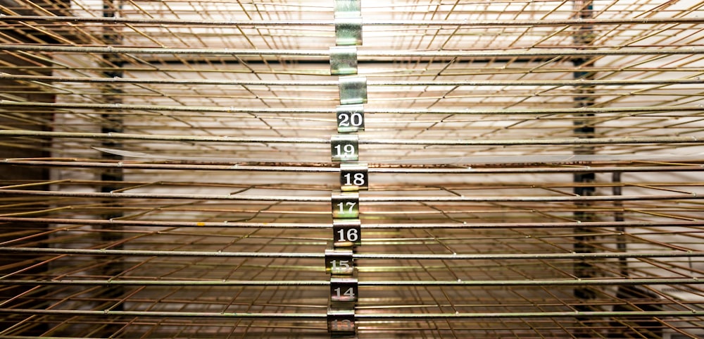 a close up of a metal rack with numbers on it