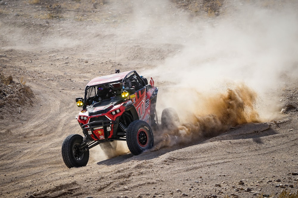 a truck driving down a dirt road