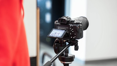 a camera attached to a tripod in a room