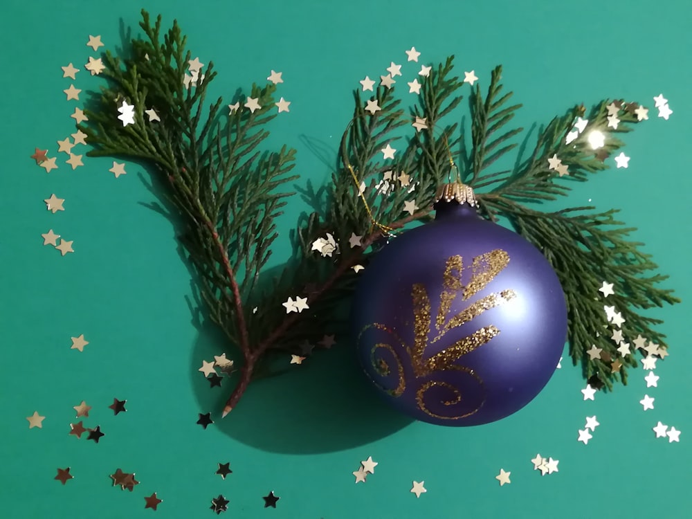a purple ornament with a gold design on it
