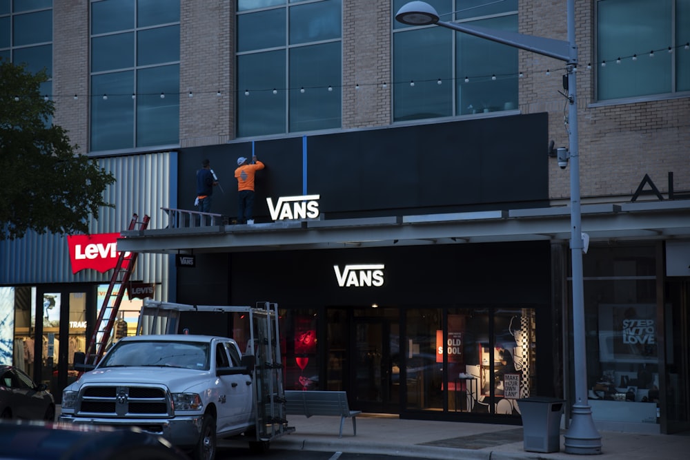 a van is parked in front of a store