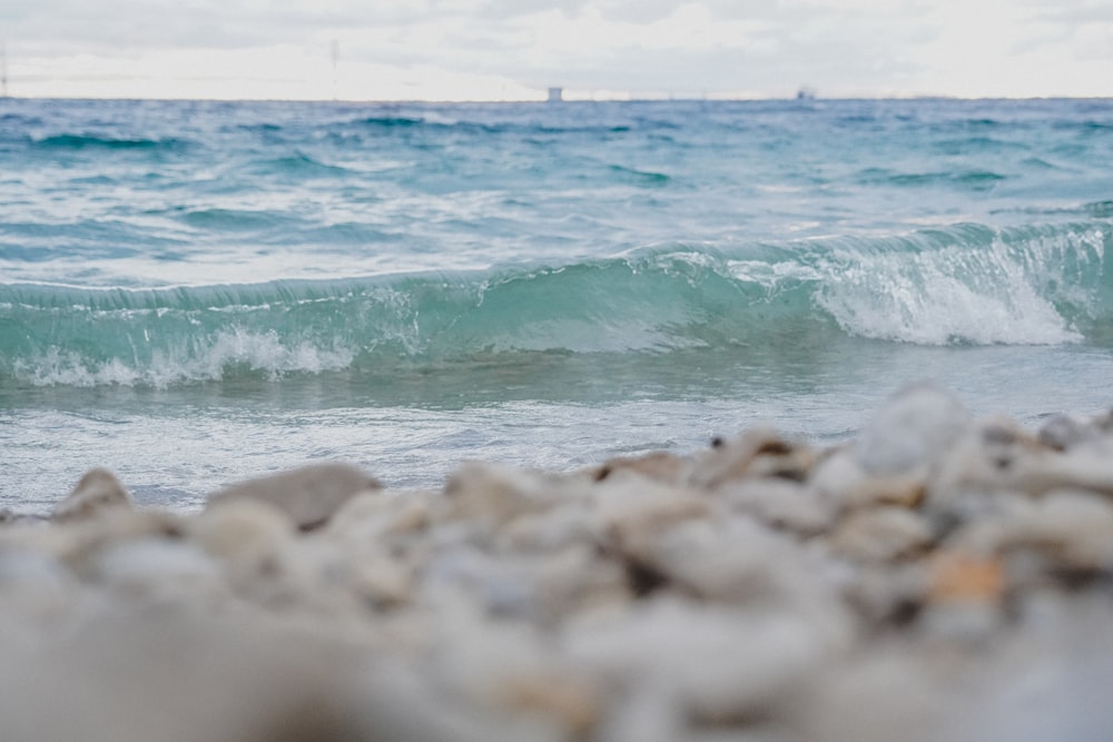 a close up of a wave coming in to shore