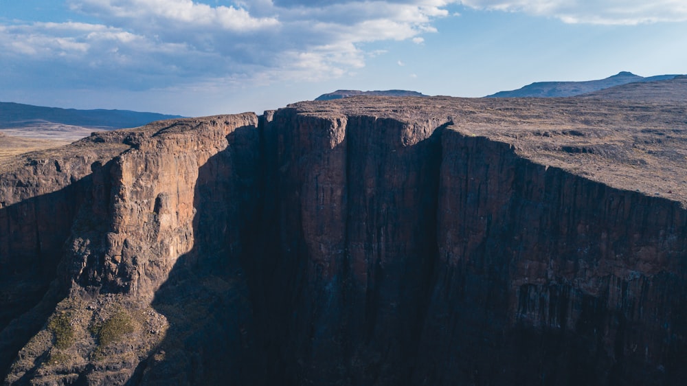 a view of a rocky mountain with a sky background