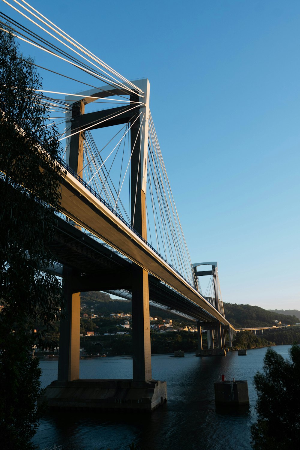 a view of a bridge over a body of water