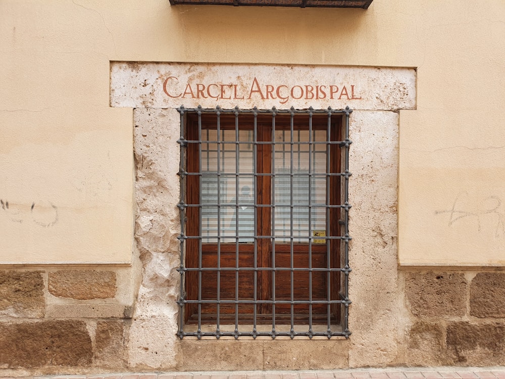 a window with bars on the outside of it