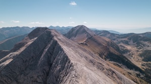 a view of a mountain range from the top of a mountain