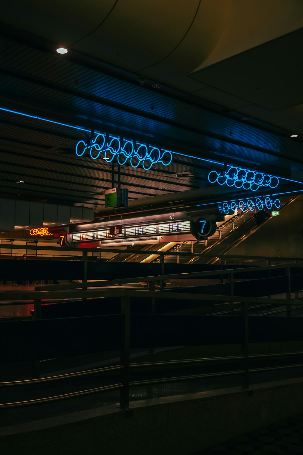 a train traveling through a train station at night