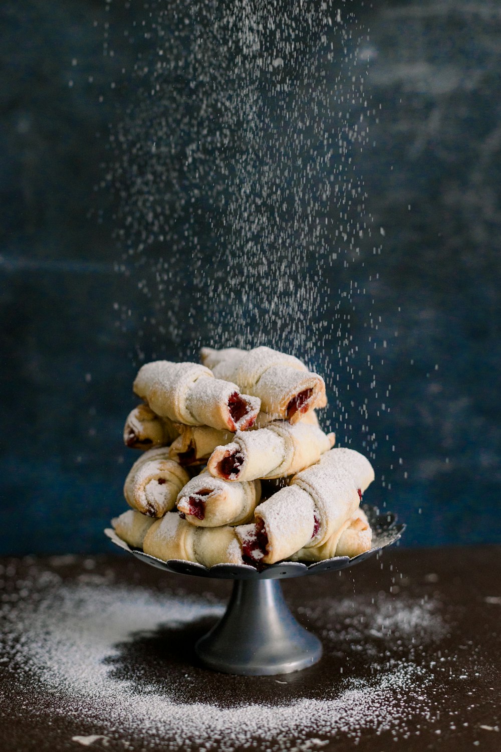 a pile of powdered sugar sprinkled on top of pastries