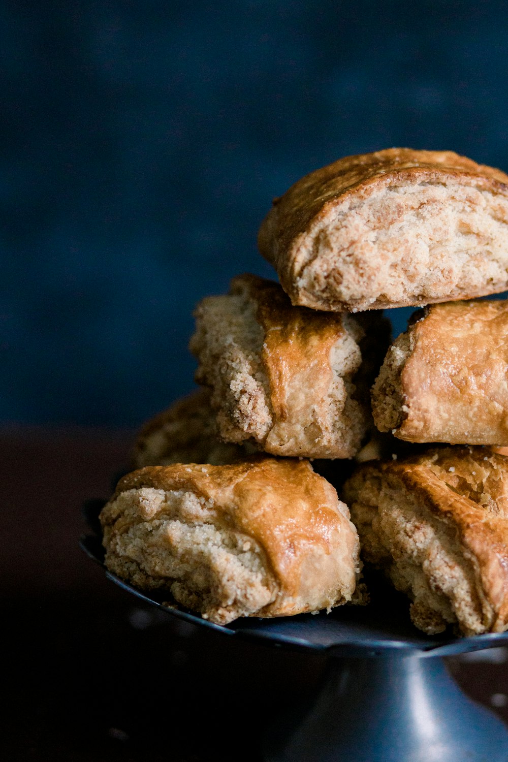 a pile of biscuits sitting on top of a metal plate