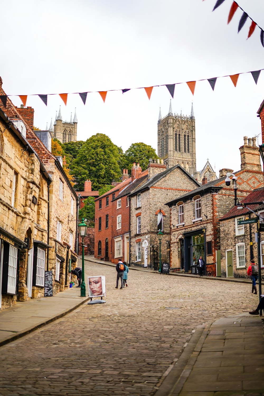 a cobblestone street in a small town