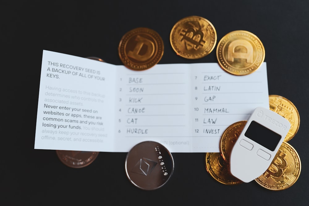 a cell phone sitting on top of a pile of coins