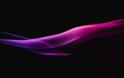 A sleek digital waveform glowing in electric violet against a dark slate grey background.