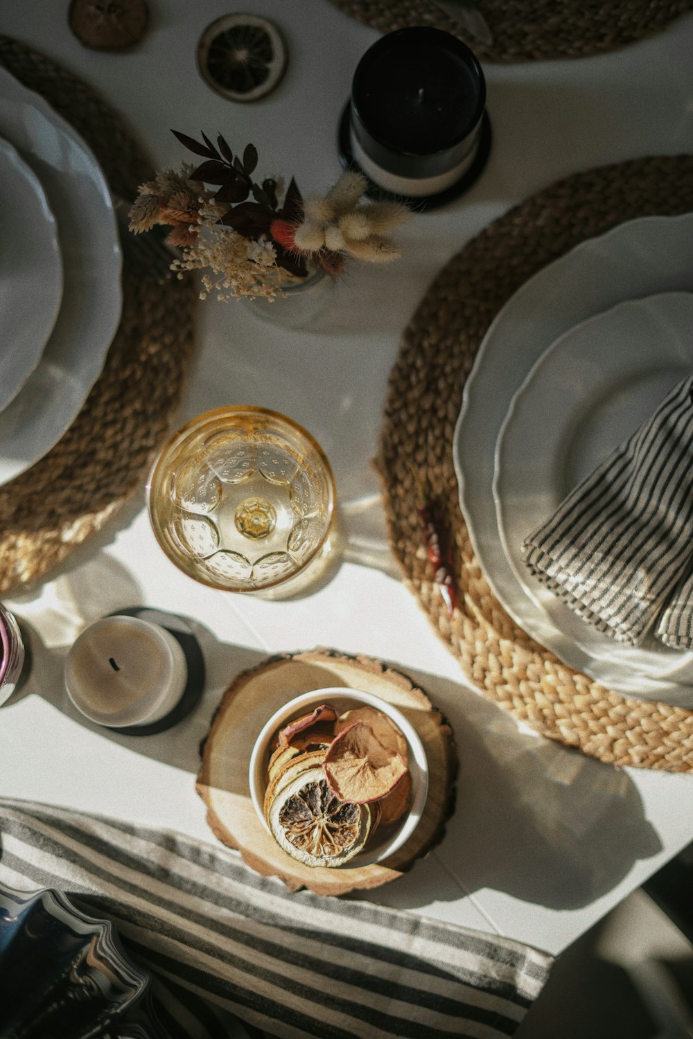 a table topped with plates and bowls filled with food