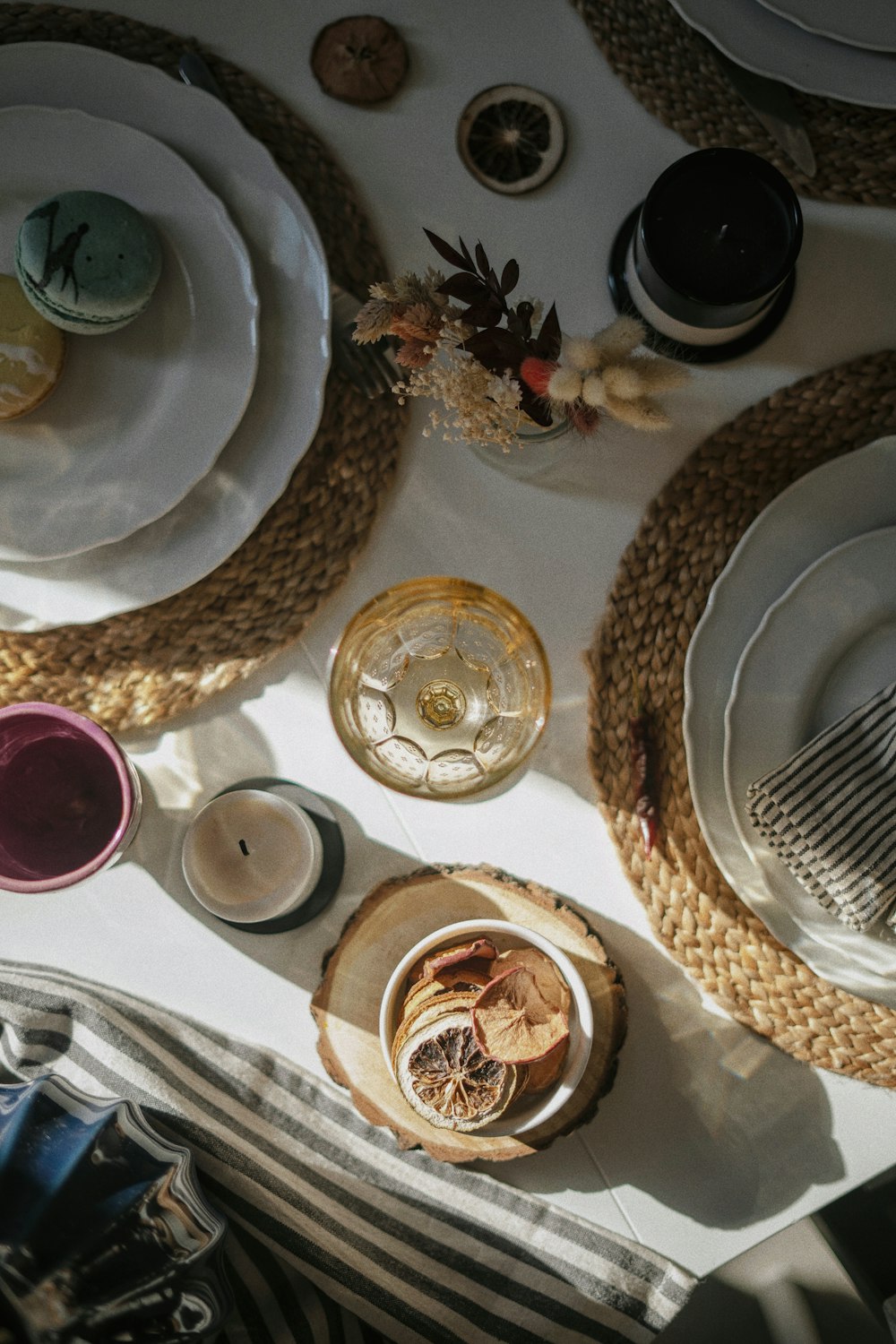 a table topped with plates and bowls filled with food