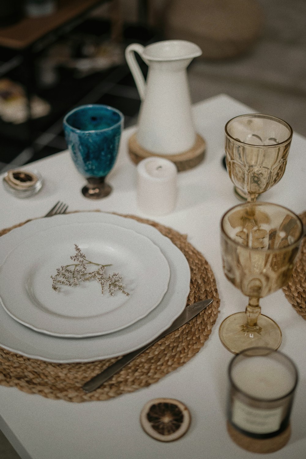 a table with a white table cloth and place settings