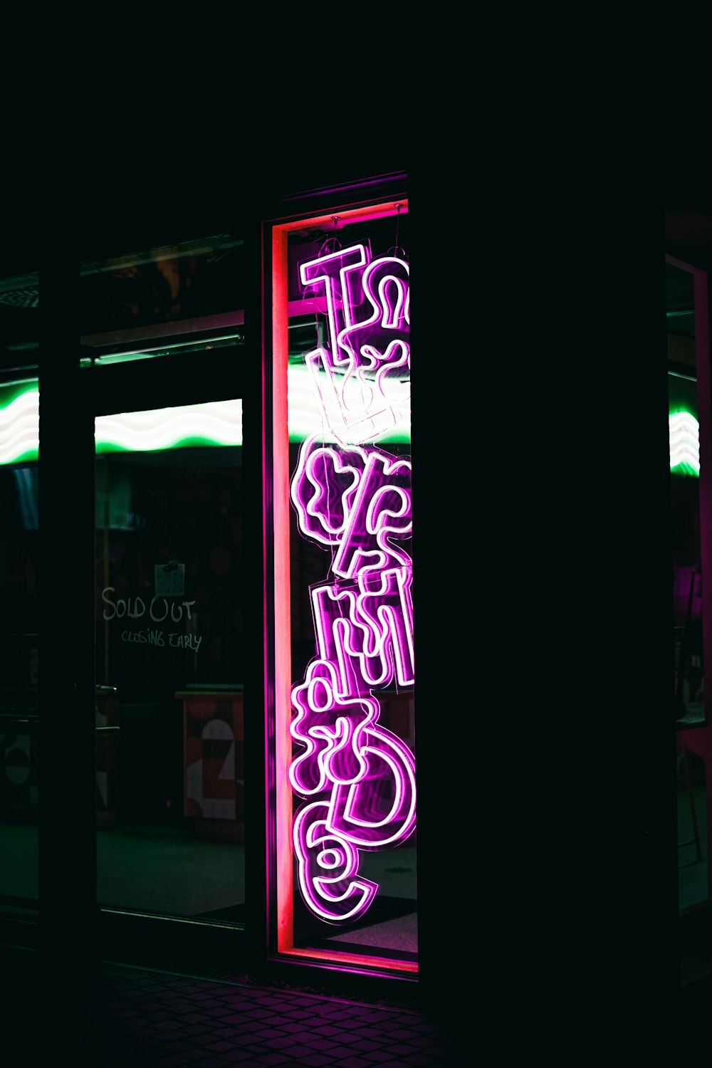 a neon sign that reads stop and go