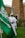 a man standing next to a green flag