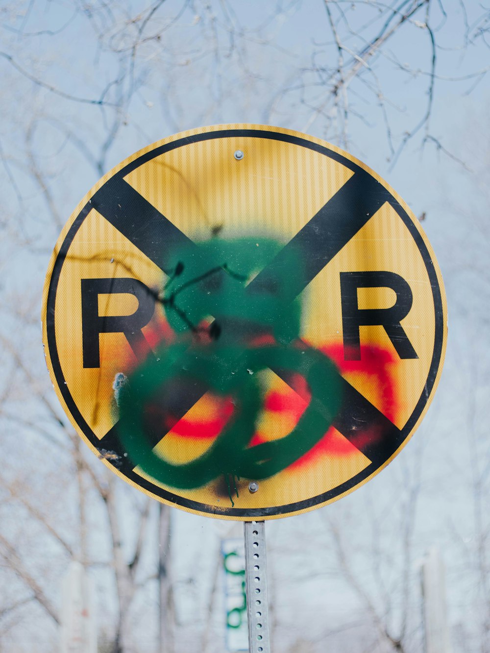 a street sign that has been spray painted