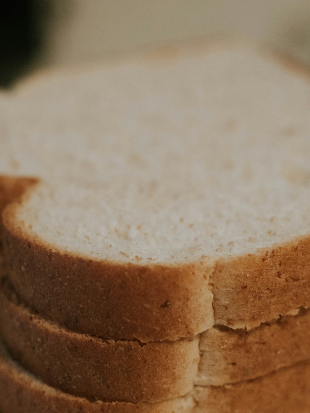 a stack of slices of bread sitting on top of a table