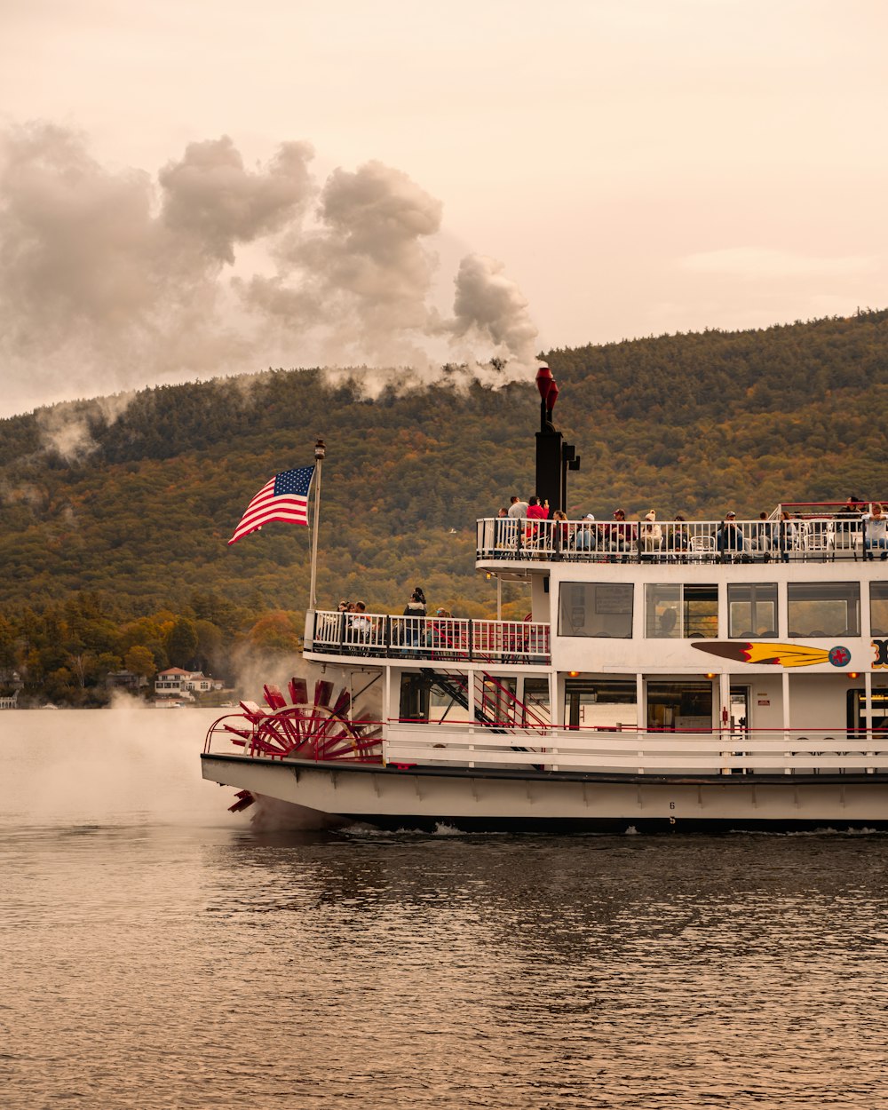 a large white boat with a flag on top of it