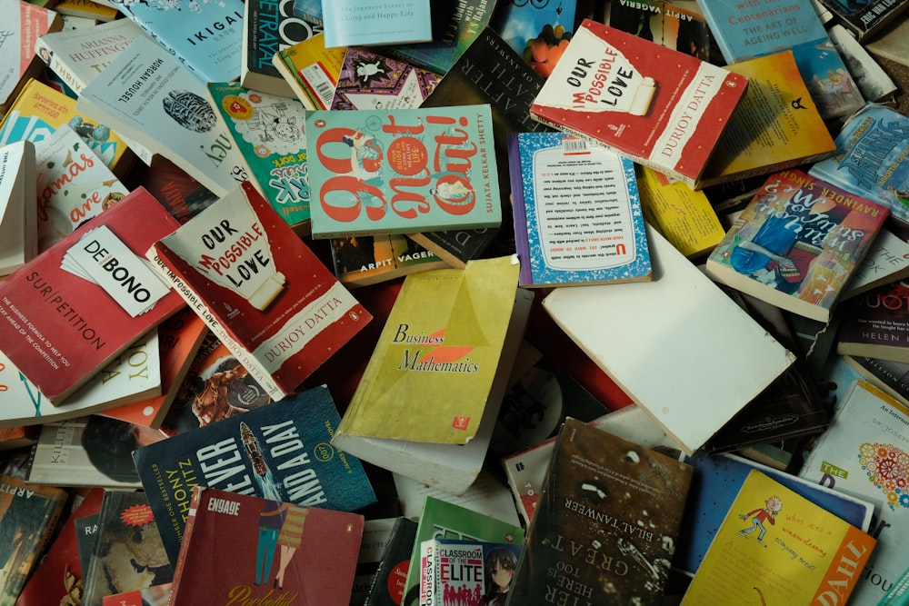 a pile of books sitting next to each other