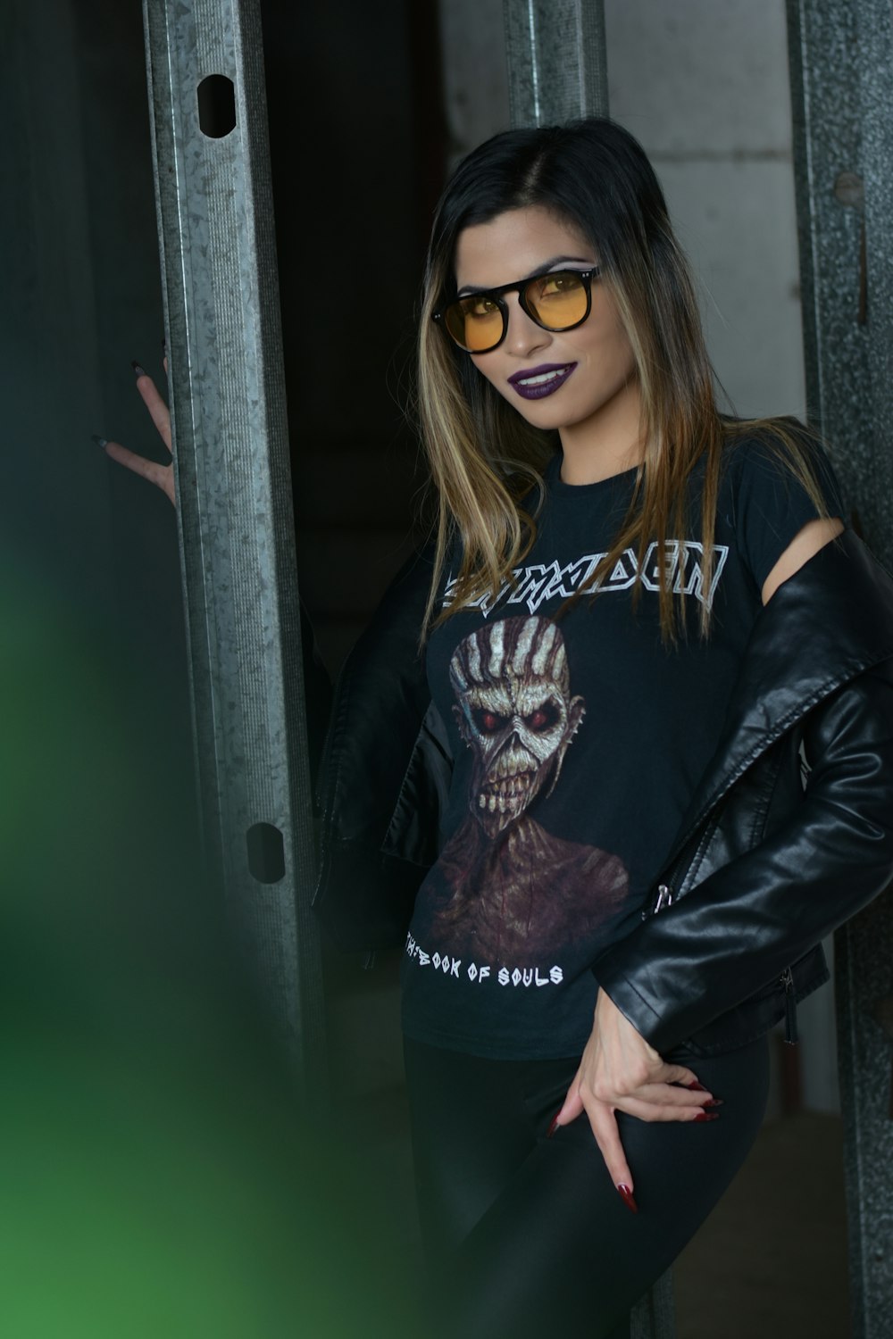 a woman wearing a black shirt with a skeleton on it