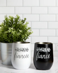 a couple of cups that are on a table