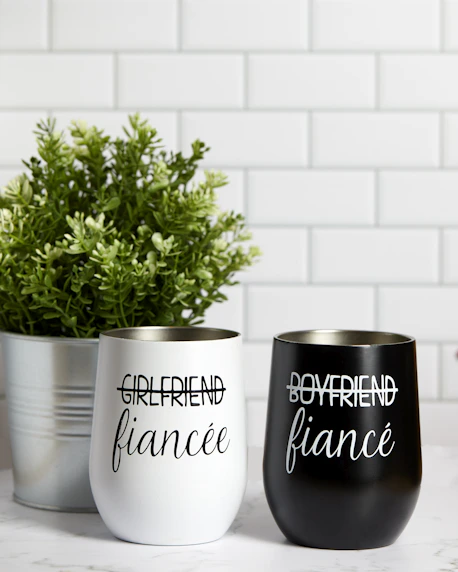 a couple of cups that are on a table