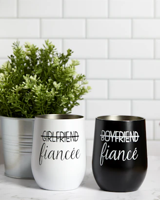a couple of cups that are on a table