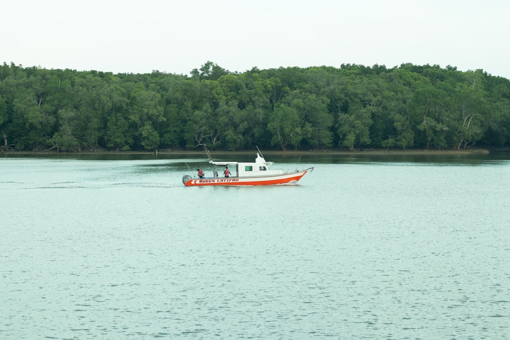 a small boat traveling across a large body of water