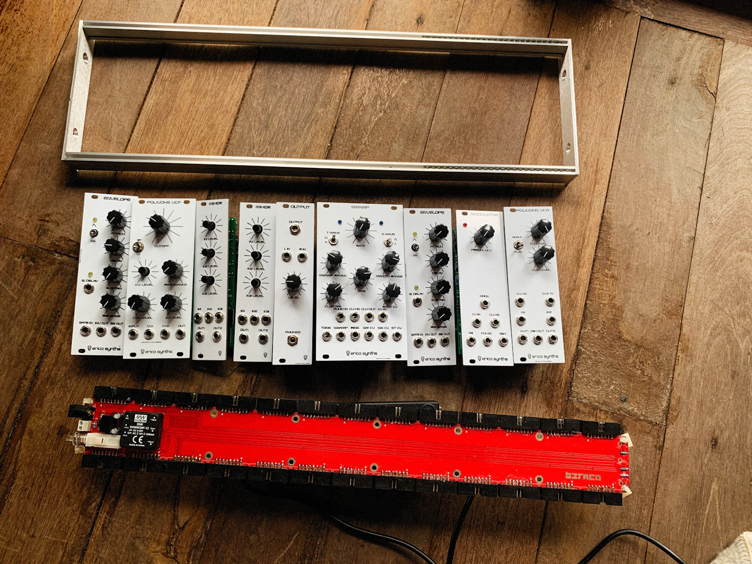 Coldbox desktop skiff laid out on the workshop floor with its bus board and four modules, in stock