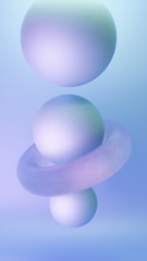Three spherical objects are arranged vertically with a toroidal shape encircling the middle sphere. The background is a gradient of soft blue and violet hues, creating a smooth and serene atmosphere.