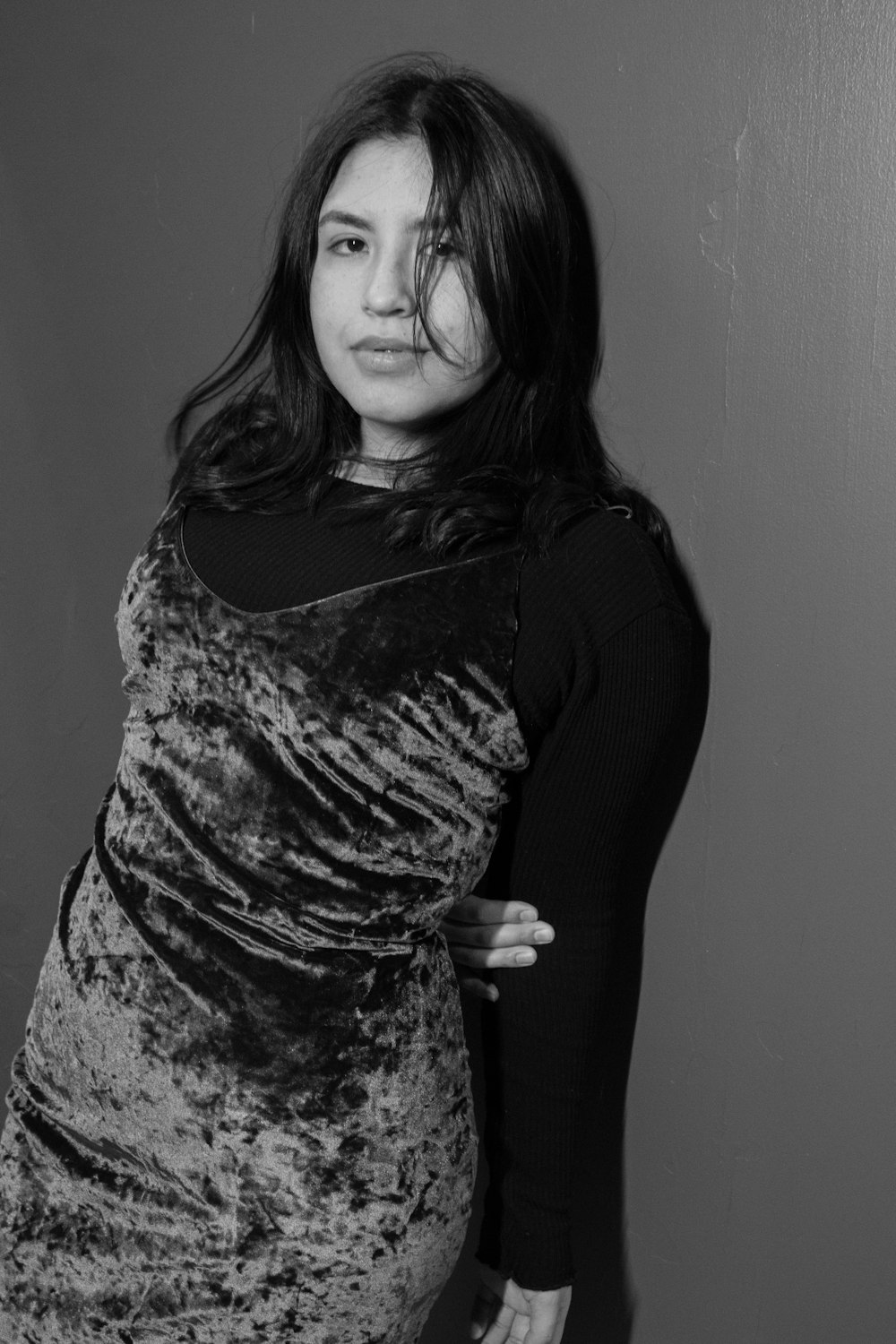 a woman posing for a picture in a black and white photo