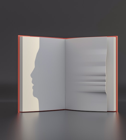 an open book with a shadow of a person