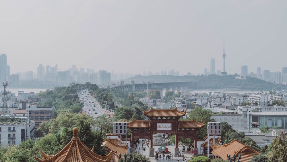 a view of a city with a pagoda in the foreground