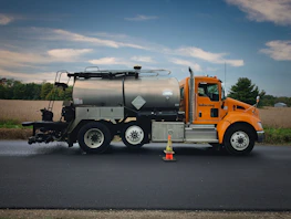Licensed and insured contractor badge displayed proudly on a work truck with a vibrant orange accent.