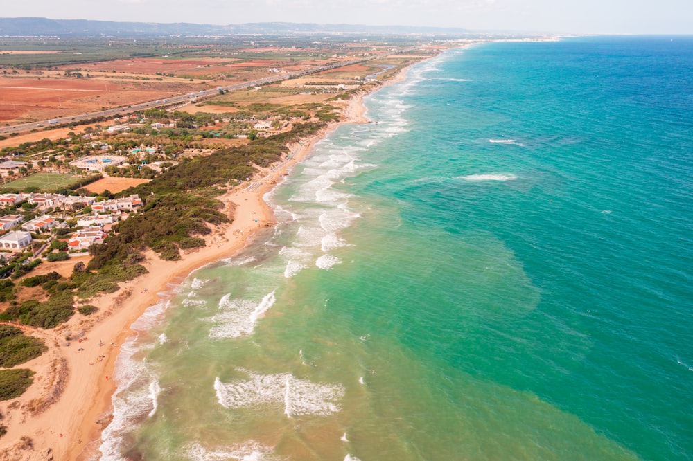 an aerial view of a beach and ocean