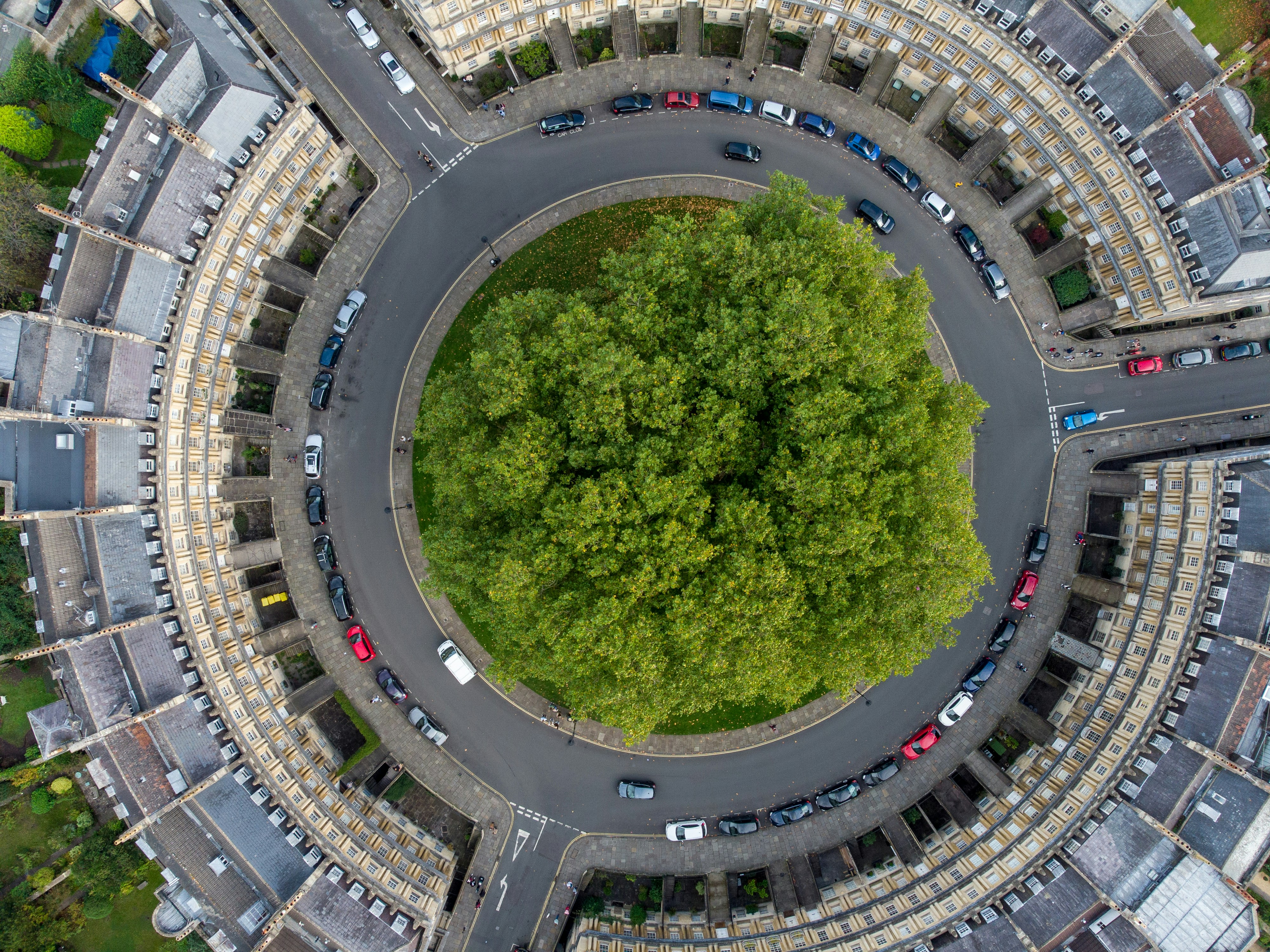 woman wearing yellow long-sleeved dress under white clouds and blue sky during daytime
