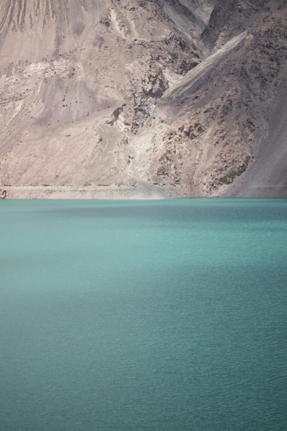 a boat floating on top of a large body of water