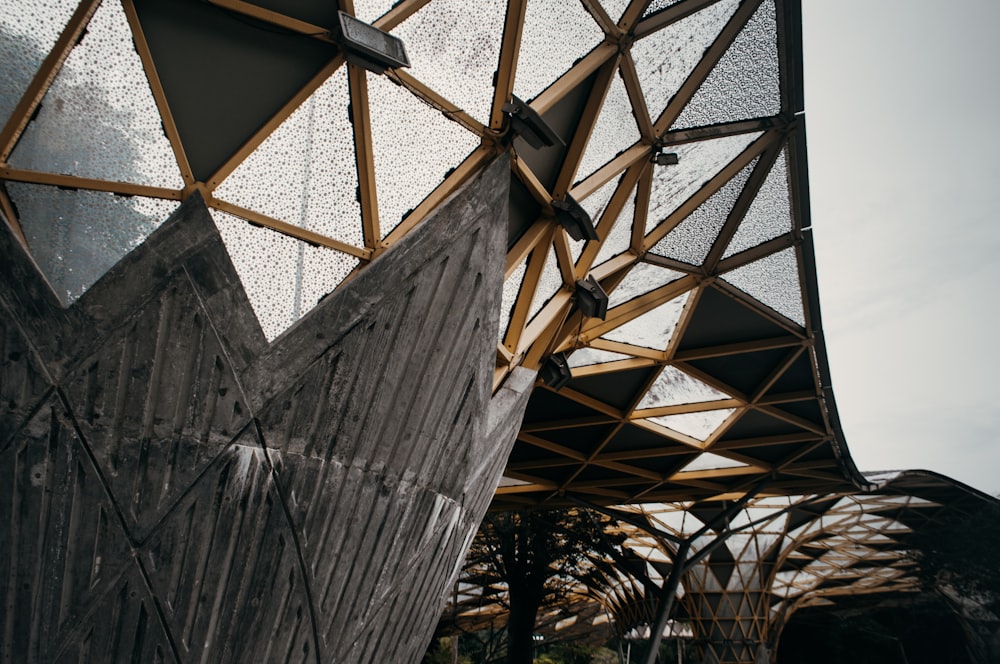 a close up of a metal structure with a sky background