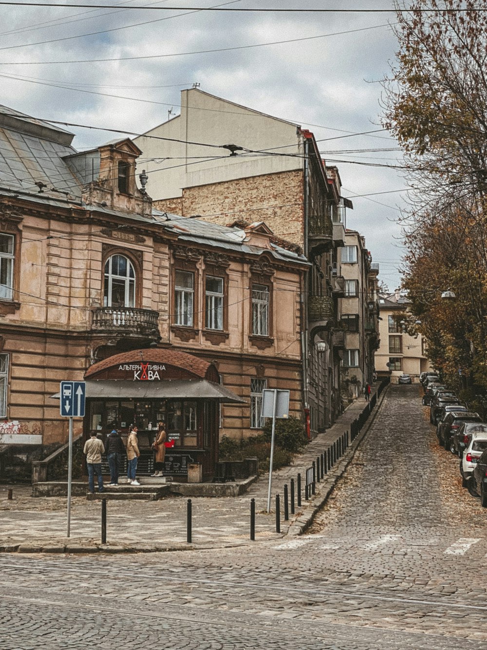 a group of people standing outside of a building