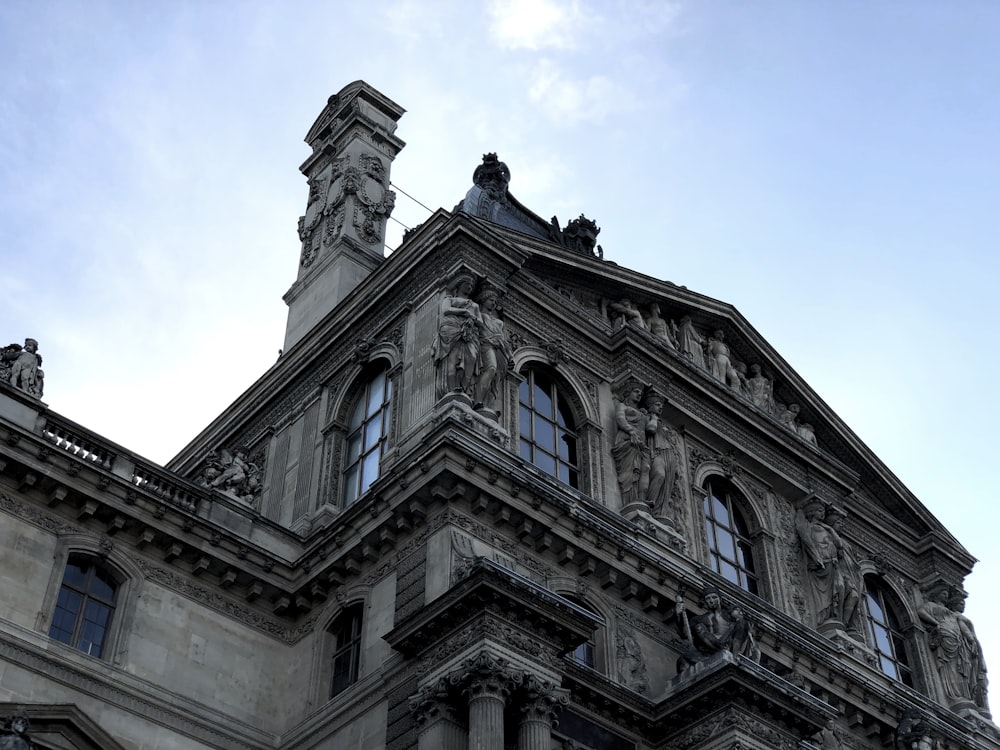 a tall building with a clock on the top of it