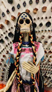 Bar interior decorated with colorful Mexican skull stickers for Day of the Dead.