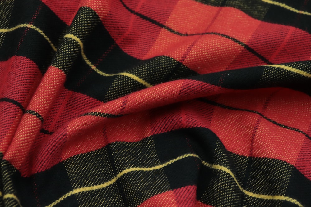 a close up of a red and black plaid fabric