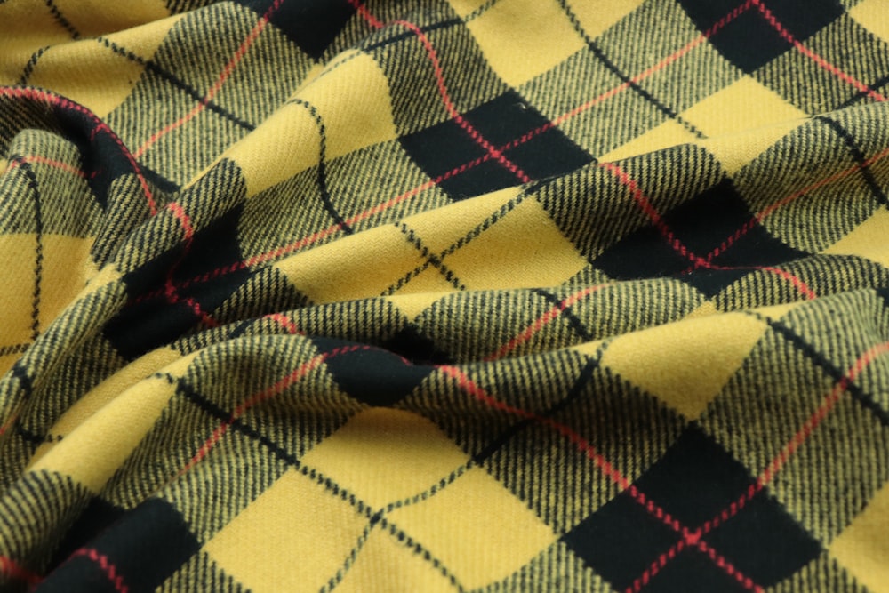 a close up of a yellow and black plaid fabric