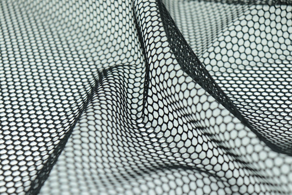 a black and white photo of a mesh fabric