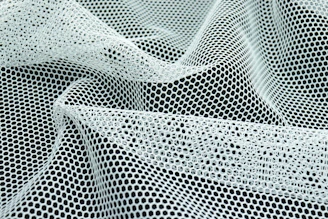 a close up of a black and white mesh