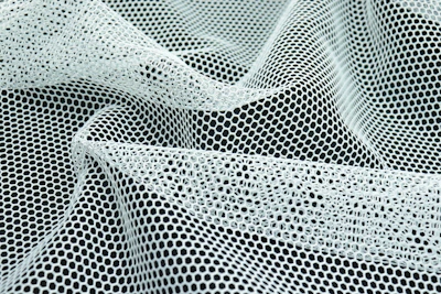 a close up of a black and white mesh