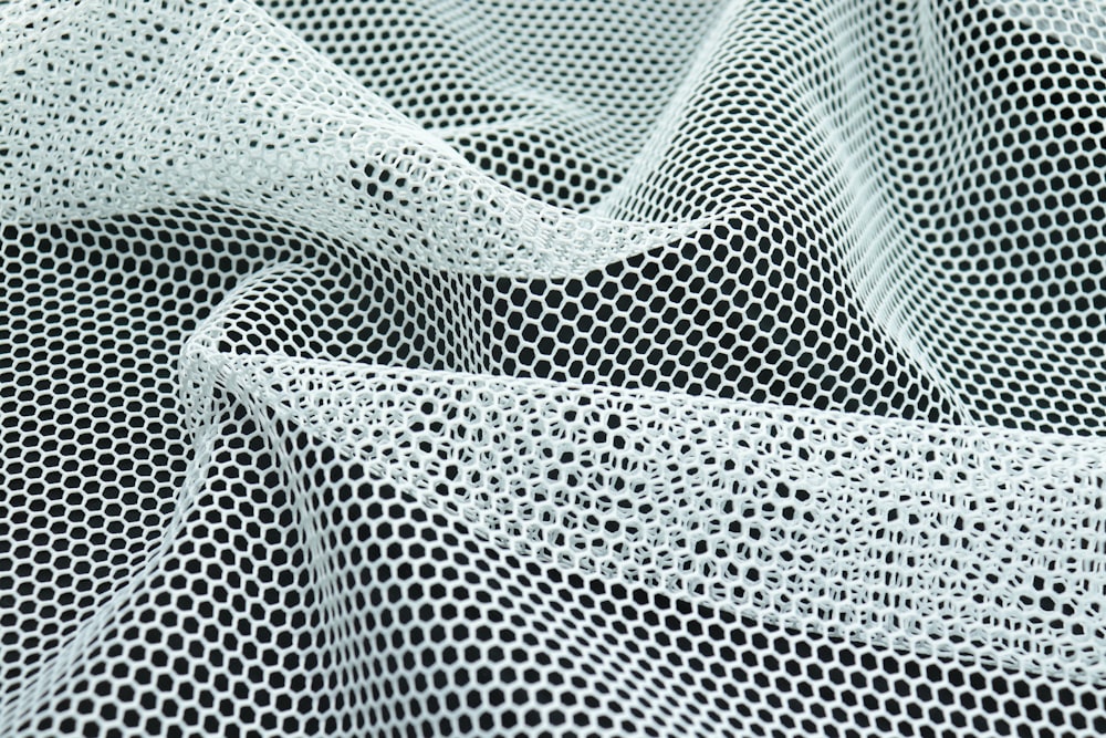 a close up of a black and white mesh