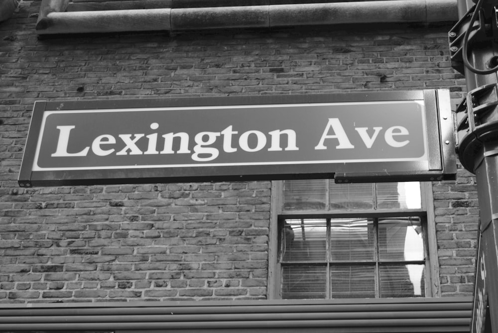 a black and white photo of a street sign